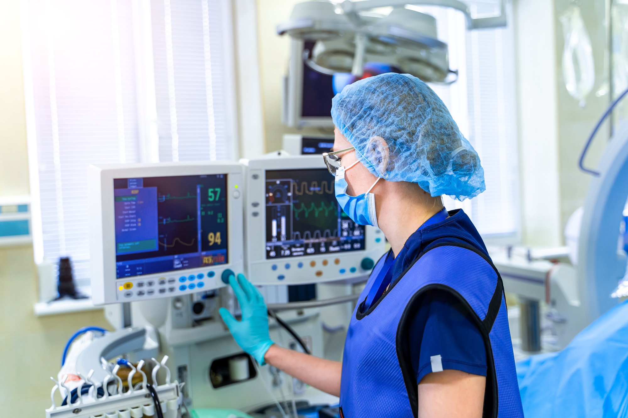 Medical technician working on heart rate monitor Medical technician working on heart rate monitor